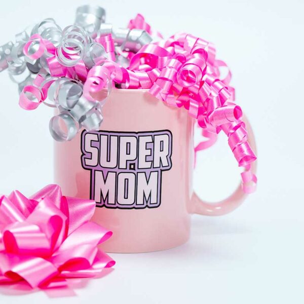 coffee mug that says super mom and has ribbons inside